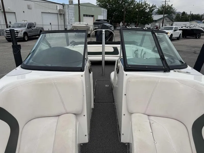 Slide: The Image of 1999 MasterCraft Powerstar 200 boat interior with dual windshields and seating. - 2