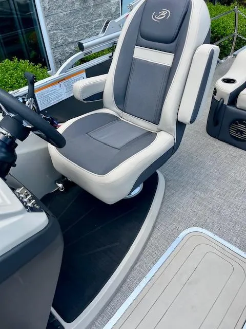 Slide: The Image of Captain's chair on 2023 Barletta Cabrio 22UC pontoon boat, featuring sleek design and comfortable seating. - 12