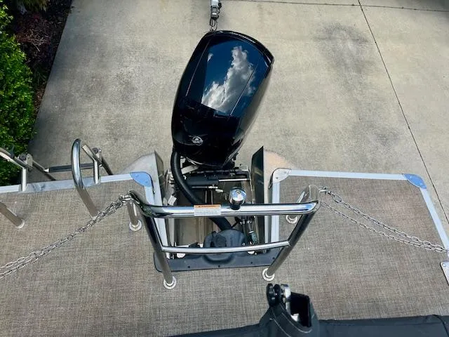 Slide: The Image of 2023 Barletta Cabrio 22UC boat engine and deck, viewed from above. - 13