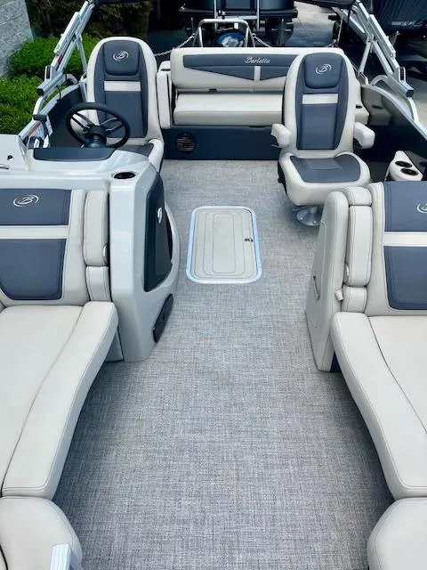 Slide: The Image of 2023 Barletta Cabrio 22UC interior with gray and beige seating, spacious layout. - 6