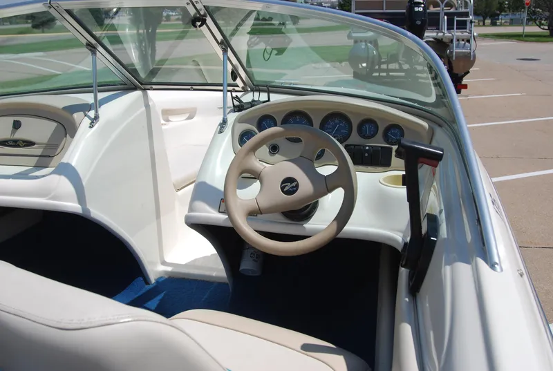 Slide: The Image of 1997 Sea Ray 175 Bow Rider interior with steering wheel and dashboard controls. - 5
