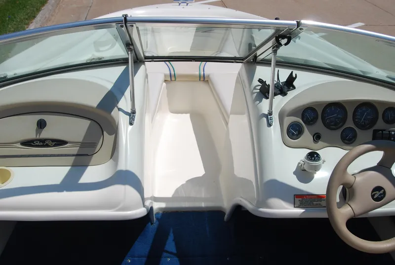 Slide: The Image of 1997 Sea Ray 175 Bow Rider dashboard with steering wheel and instrument panel. - 8