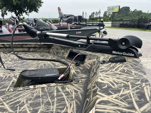 Slide: The Image of 2024 Lowe Stinger 175C boat with camo design and MotorGuide trolling motor. - 9