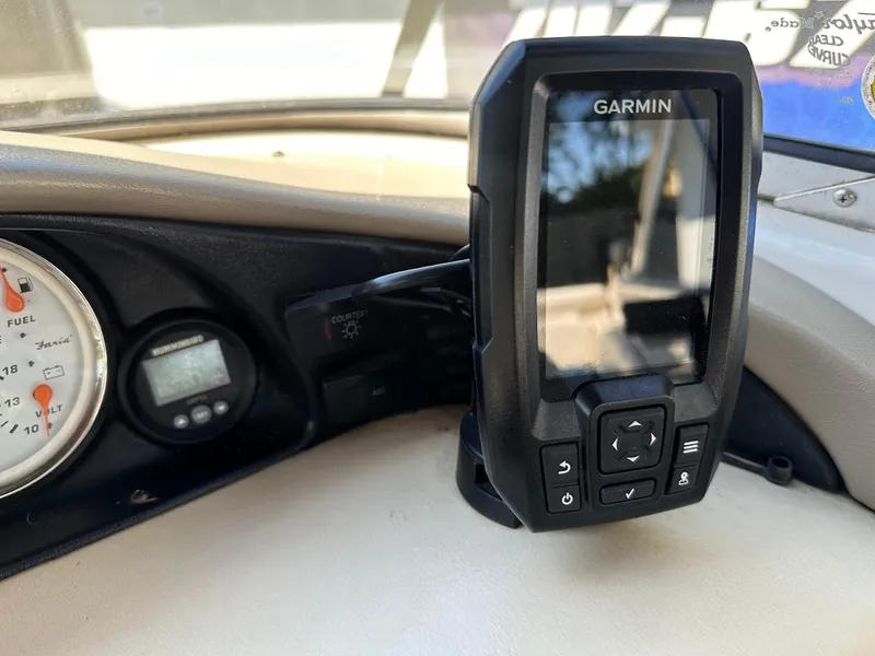 Slide: The Image of Dashboard of a 2001 Larson SEi 190 boat with Garmin GPS device. - 24