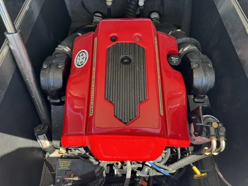 Slide: The Image of Red engine of a 2006 Custom B52 23 boat, detailed view. - 2