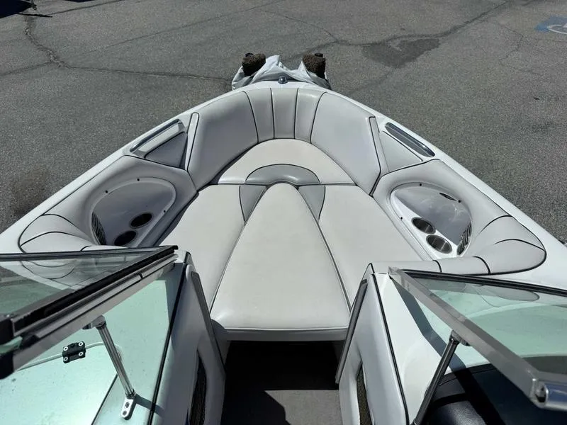 Slide: The Image of Interior view of a 2006 Custom B52 23 boat with white seating. - 6