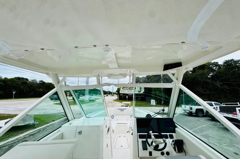 Slide: The Image of Interior view of 2026 Sailfish 276 DC boat cockpit with modern controls and seating. - 24