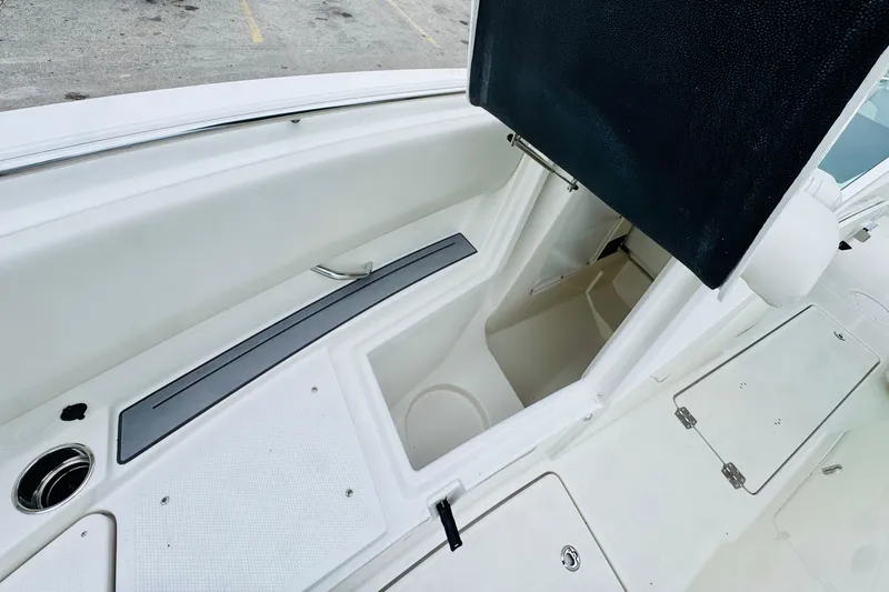 Slide: The Image of 2026 Sailfish 276 DC boat interior storage compartment with open hatch. - 27