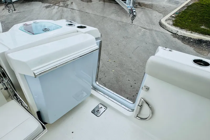 Slide: The Image of 2026 Sailfish 276 DC boat interior with seating and storage compartment. - 31