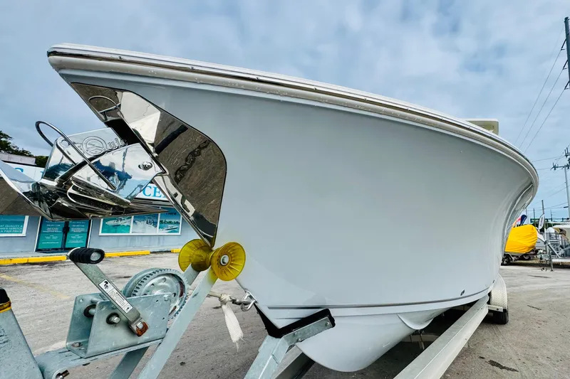 Slide: The Image of 2026 Sailfish 276 DC boat on trailer, showcasing sleek hull design. - 4