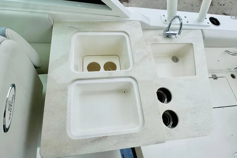 Slide: The Image of 2026 Sailfish 276 DC boat interior with dual sinks and faucet. - 40