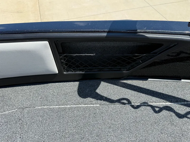 Slide: The Image of Interior view of 2022 Ranger 1880MS boat with storage compartment and netting. - 11