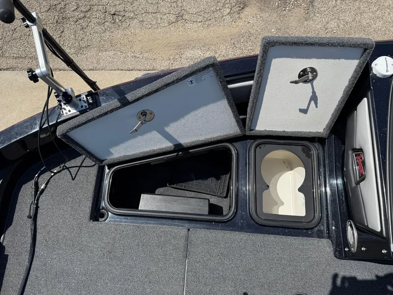 Slide: The Image of 2022 Ranger 1880MS boat storage compartments with open lids and visible interior. - 13
