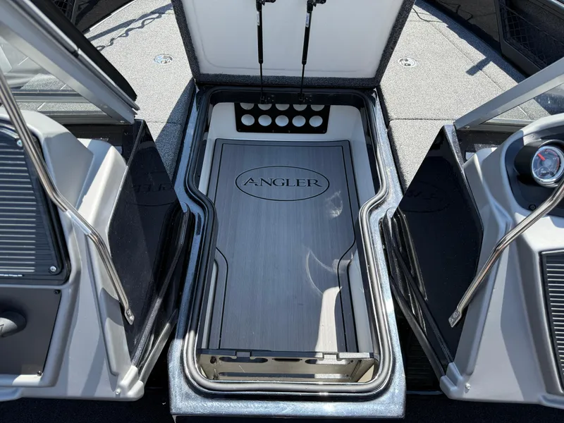Slide: The Image of 2022 Ranger 1880MS boat storage compartment with "Angler" logo, open doors, and sleek design. - 16