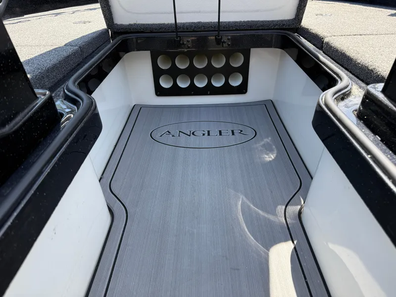 Slide: The Image of Interior of 2022 Ranger 1880MS boat with "Angler" logo on floor mat. - 17