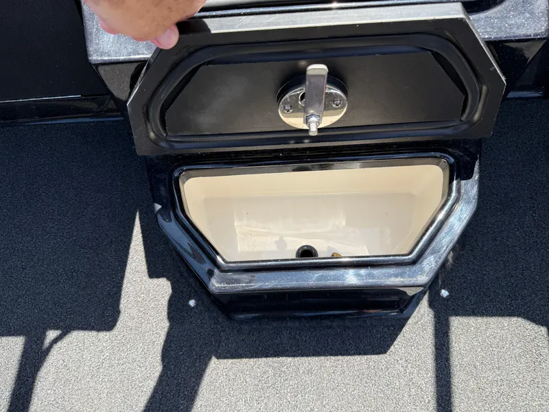 Slide: The Image of Open storage compartment on 2022 Ranger 1880MS boat, showing interior details. - 18