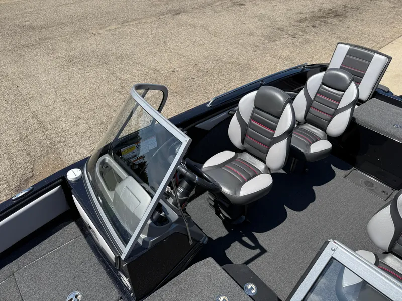 Slide: The Image of 2022 Ranger 1880MS boat interior with sleek seats and windshield. - 20