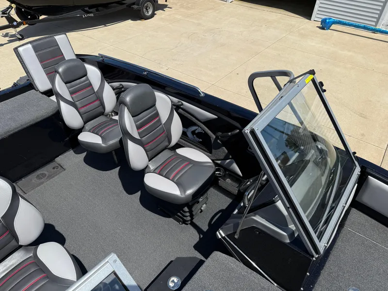 Slide: The Image of 2022 Ranger 1880MS boat interior with modern seating and windshield. - 21