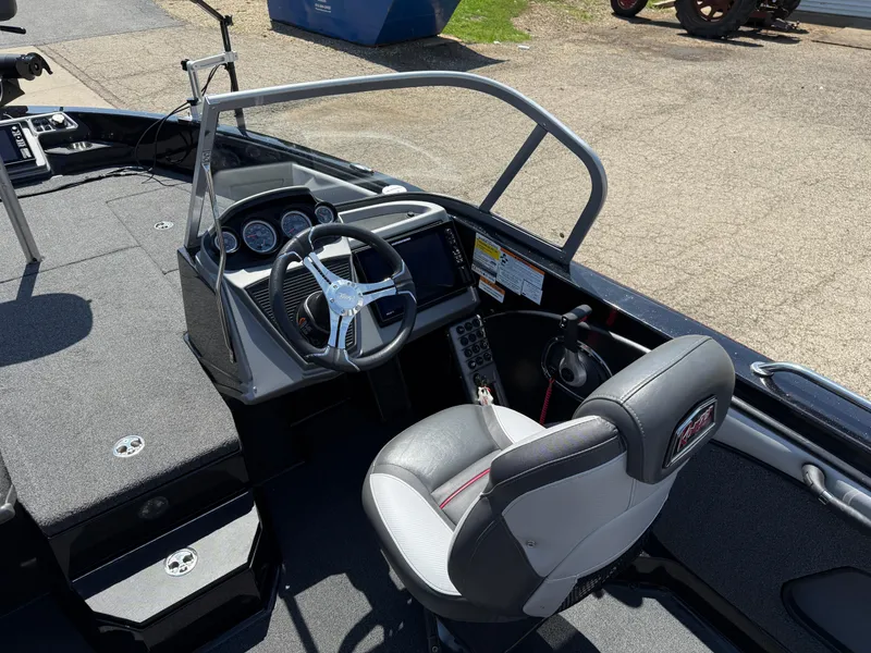 Slide: The Image of 2022 Ranger 1880MS boat interior with steering wheel and dashboard controls. - 22