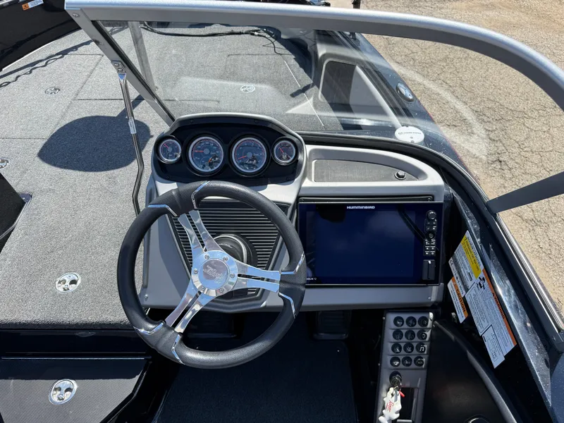 Slide: The Image of 2022 Ranger 1880MS boat dashboard with steering wheel and electronic display. - 23