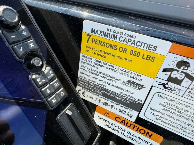 Slide: The Image of Ranger 1880MS 2022 boat capacity label, 7 persons or 950 lbs, safety compliance details. - 25
