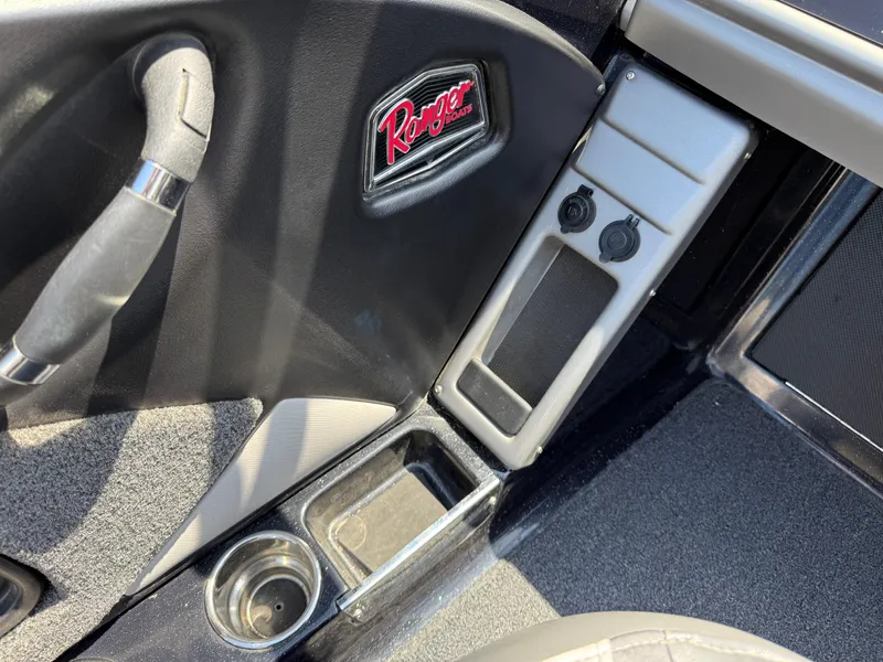 Slide: The Image of Interior of 2022 Ranger 1880MS boat with cup holder and control panel. - 28