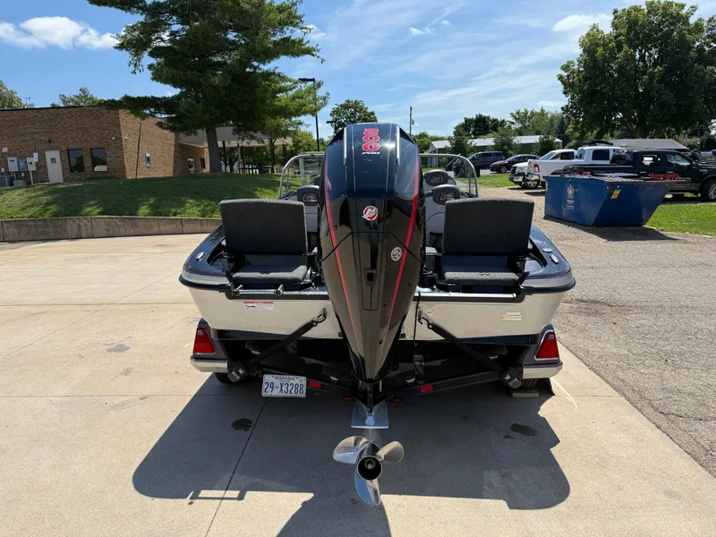 Slide: The Image of 2022 Ranger 1880MS boat with outboard motor, parked outdoors on a sunny day. - 6