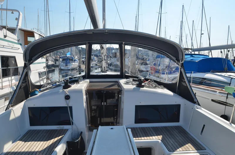 Slide: The Image of Cockpit view of 2021 Jeanneau Sun Odyssey 440 sailboat in marina. - 10