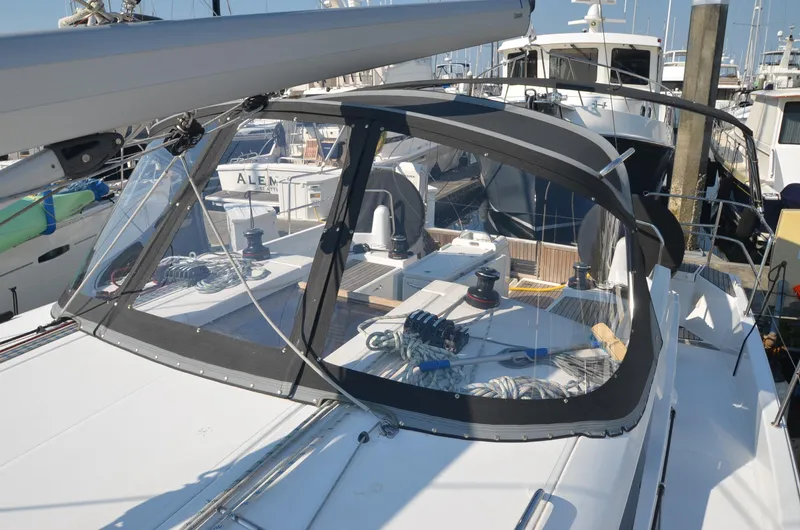 Slide: The Image of 2021 Jeanneau Sun Odyssey 440 sailboat with sleek design and modern cockpit features. - 11