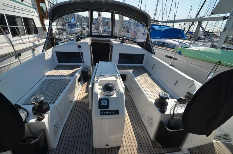 Slide: The Image of Cockpit of 2021 Jeanneau Sun Odyssey 440 sailboat, featuring modern design and spacious seating. - 16