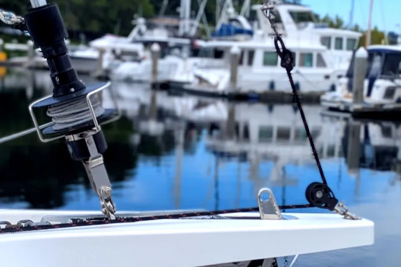 Slide: The Image of Jeanneau Sun Odyssey 440 sailboat detail at marina, 2021 model, with blurred boats in background. - 17
