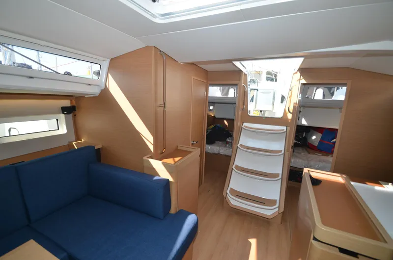 Slide: The Image of Interior of 2021 Jeanneau Sun Odyssey 440 yacht, featuring modern design and comfortable seating. - 28