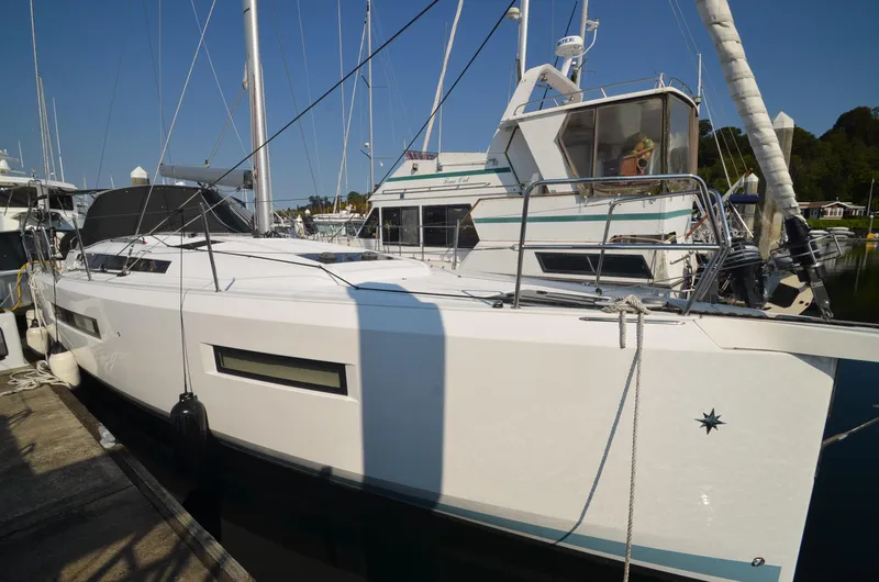 Slide: The Image of 2021 Jeanneau Sun Odyssey 440 sailboat docked at marina, side view. - 3