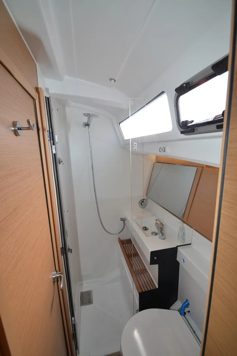 Slide: The Image of Modern bathroom in 2021 Jeanneau Sun Odyssey 440 yacht with shower and sink. - 38