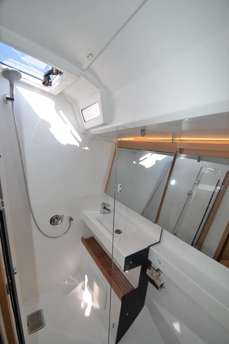 Slide: The Image of Modern bathroom in 2021 Jeanneau Sun Odyssey 440 yacht with sleek fixtures and natural light. - 39