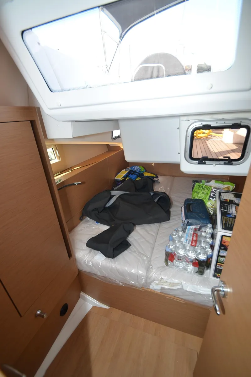 Slide: The Image of Interior cabin of 2021 Jeanneau Sun Odyssey 440 yacht with storage and supplies. - 41