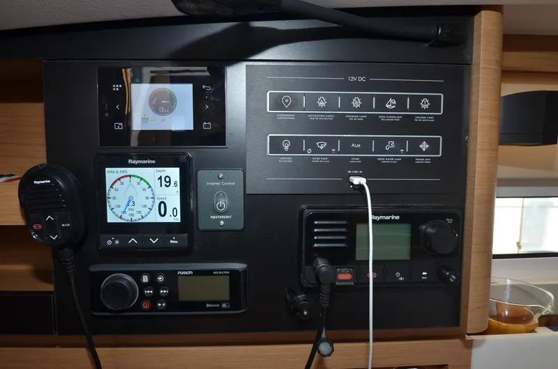 Slide: The Image of Control panel of 2021 Jeanneau Sun Odyssey 440 yacht with navigation and communication equipment. - 46