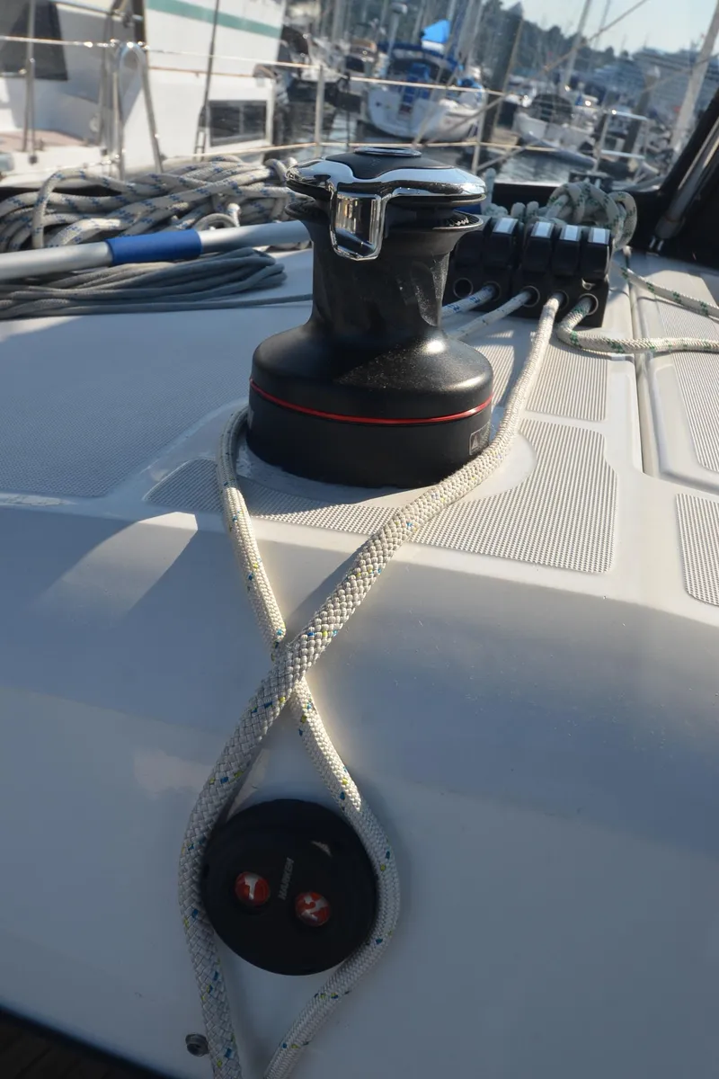 Slide: The Image of Winch and ropes on Jeanneau Sun Odyssey 440 sailboat deck, 2021 model. - 48