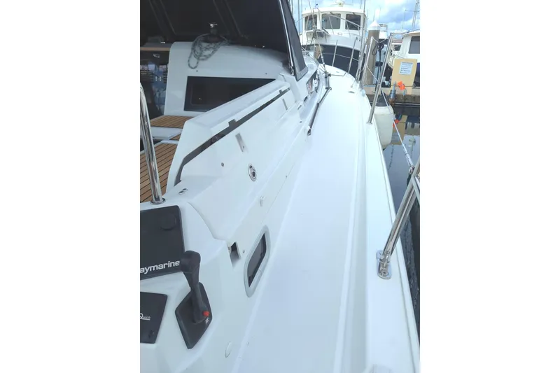 Slide: The Image of 2021 Jeanneau Sun Odyssey 440 sailboat deck view at marina. - 7