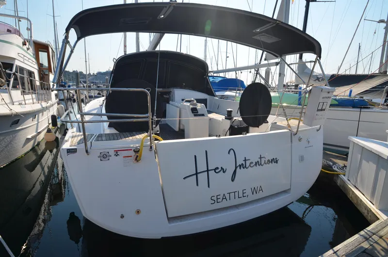 Slide: The Image of Jeanneau Sun Odyssey 440 yacht docked, named "Her Intentions," in Seattle marina, 2021 model. - 8