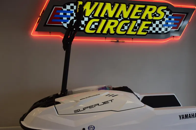 Slide: The Image of 2025 Yamaha WaveRunner SuperJet in showroom under "Winners Circle" sign. - 11