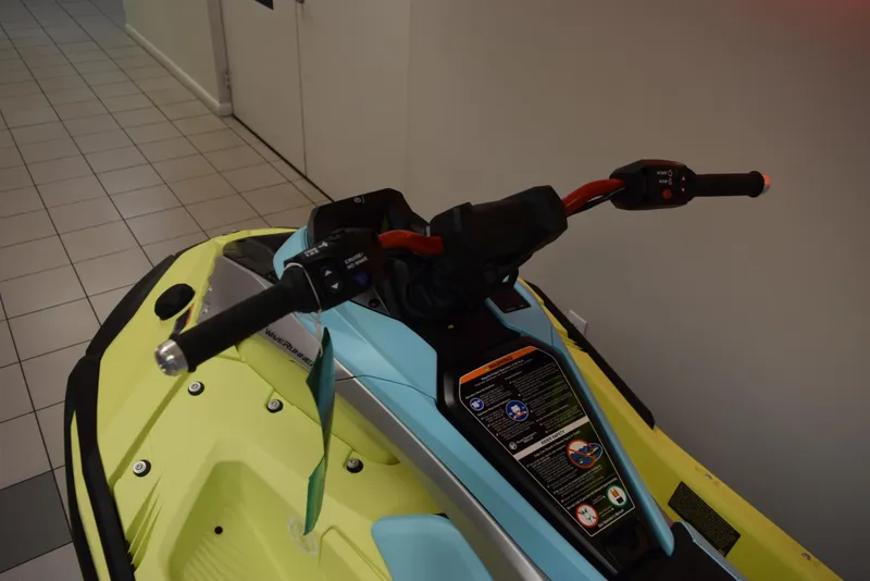 Slide: The Image of 2025 Yamaha WaveRunner JetBlaster PRO 2-Up handlebars and controls in a showroom. - 12
