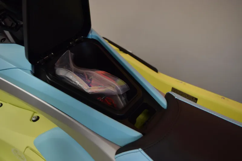 Slide: The Image of 2025 Yamaha WaveRunner JetBlaster PRO 2-Up storage compartment open with items inside. - 13