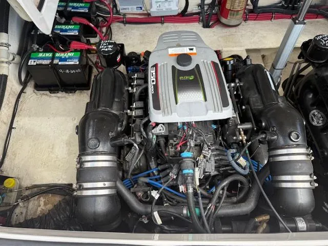 Slide: The Image of Engine compartment of a 2013 Regal 3200 Bowrider with visible battery setup. - 30