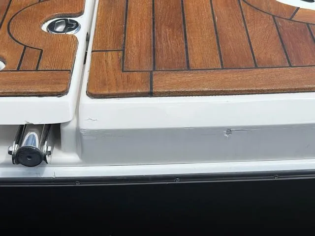 Slide: The Image of 2013 Regal 3200 Bowrider with teak deck detail, showcasing elegant design. - 35