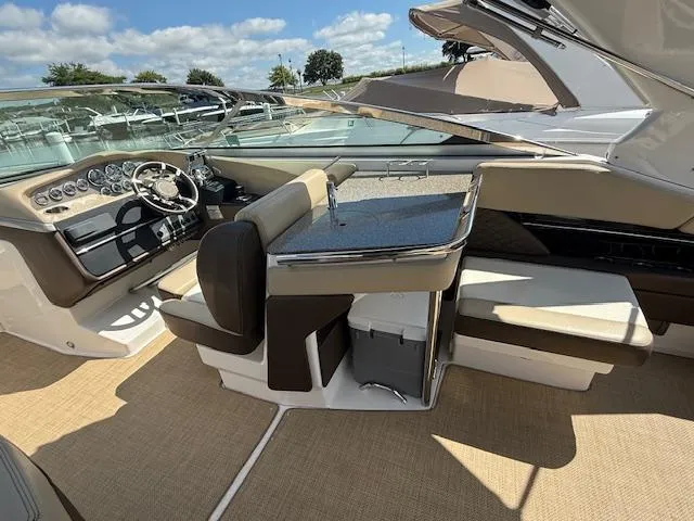 Slide: The Image of 2013 Regal 3200 Bowrider interior with luxurious seating and modern dashboard. - 5