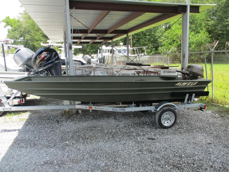 Slide: The Image of 2025 Alweld 1448 DS boat on trailer under metal canopy. - 0