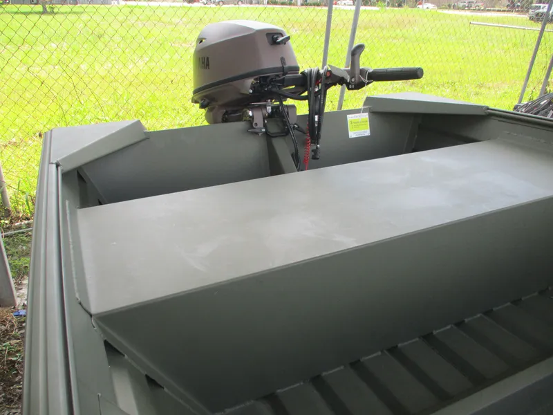 Slide: The Image of 2025 Alweld 1448 DS boat with Yamaha motor, parked outdoors. - 5