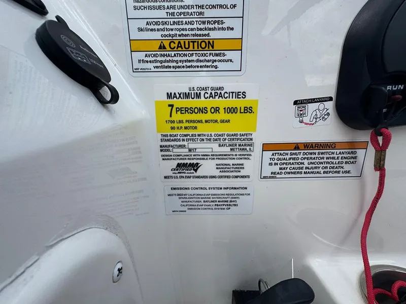 Slide: The Image of 2023 Bayliner Element M17 capacity label, 7 persons or 1000 lbs, safety warnings visible. - 12