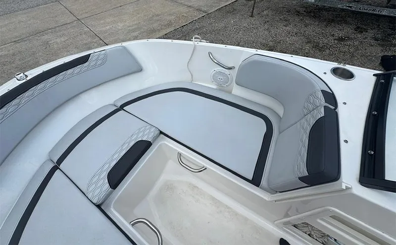 Slide: The Image of 2023 Bayliner Element M17 boat interior with cushioned seating and storage area. - 15